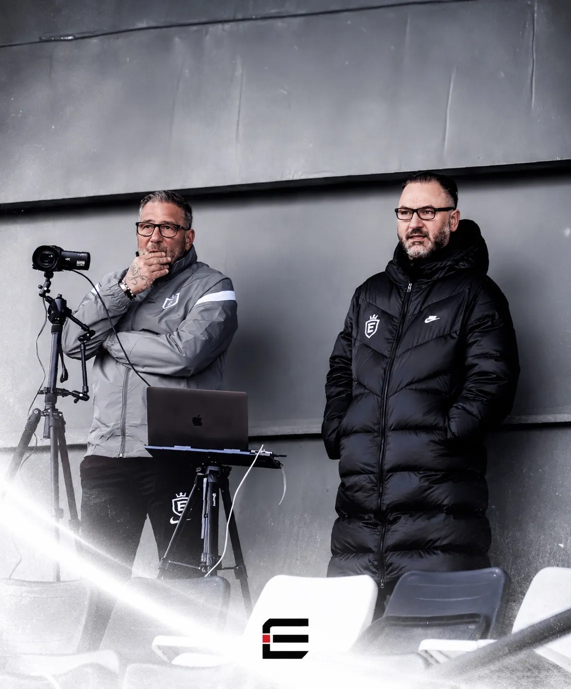 Elite Icons staff observing the pitch with a camera and laptop